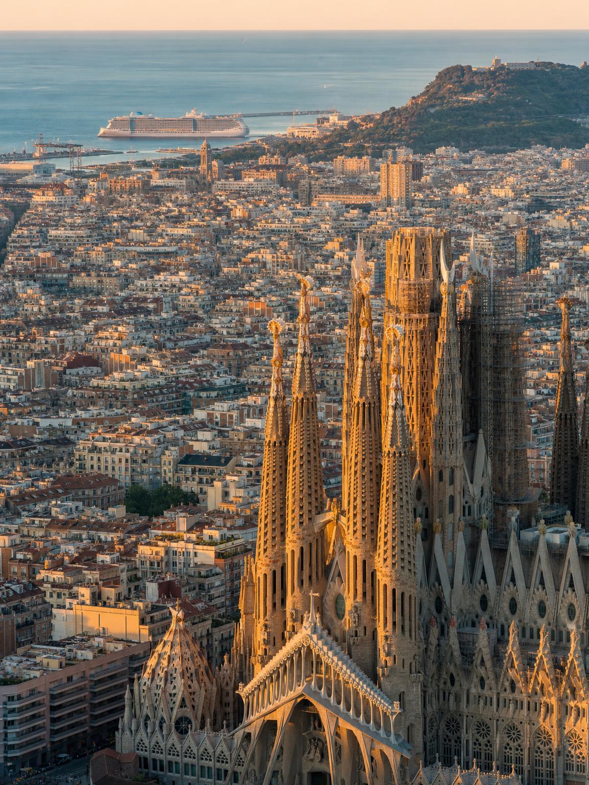 Barcelona, Spain — Day 1, Virgin Voyages Solar Eclipse Cruise 2026 Aerial editorial photograph of Barcelona harbor, Sagrada Família skyline at golden hour — Virgin Voyages Scarlet Lady embarkation port, Mediterranean Solar Eclipse Cruise August 2026